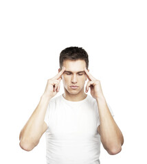 Fototapeta premium Young man focusing with closed eyes, fingers placed on temples, isolated on a clean white background, conveying concentration or meditation