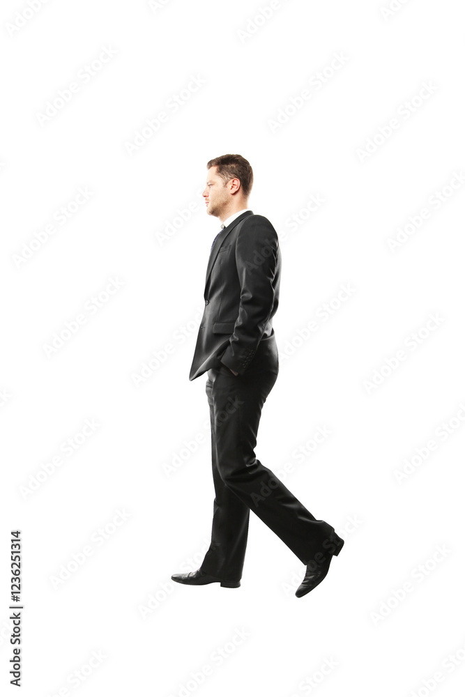 Poster Man wearing a formalsuit walking side view with hands in pockets on white background. Professional, business concept, isolated style