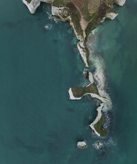 Beautiful aerial drone atmospheric dramatic landscape of cliffs on Jurassic Coast ni England during foggy Winter morning