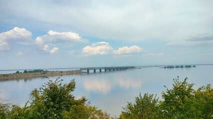 Dnieper river bridge in Cherkasy, landscape with cloudy sky and river 