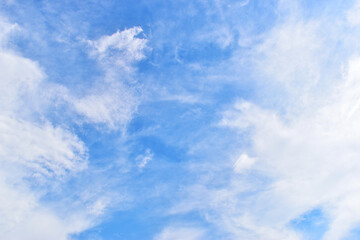 beautiful blue sky and white fluffy group of clouds with sunrise in the morning, natural background