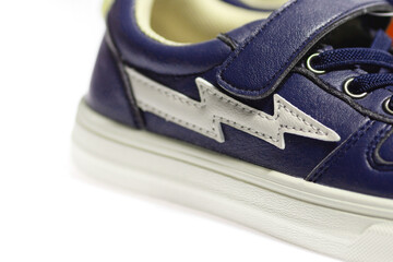 Fototapeta premium Blue sneakers on white background, sports shoes, running shoes, comfortable shoes