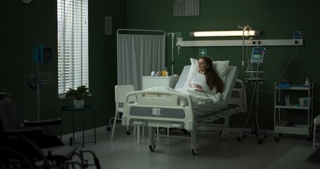 Patient looks at her X-ray as the doctor points out details on the table.