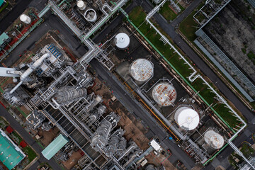 Top view with oil refinery plant form industry zone which the factory - petrochemical plant as blue sky background