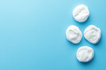 Cotton Pads on Blue Background