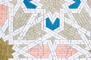Islamic mosaic with geometric patterns, vibrant colors, and symmetry. Blue, white, red tiles reflect craftsmanship and cultural heritage. C