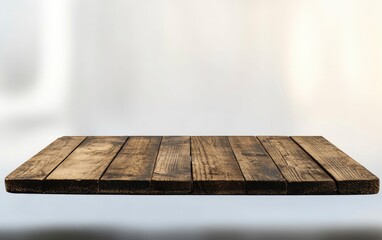 Empty wooden table top with a blurred white kitchen interior background, a product display, and a template for design. This is a stock photo 