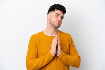 Young caucasian man isolated on white background scheming something