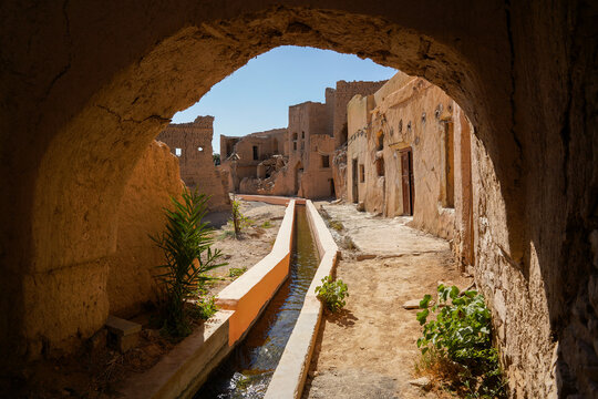 Mud village Harat As Sibani with aflaj irrigation system, popular tourist site in Oman near Nizwa