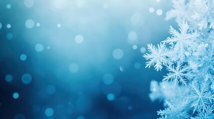 Delicate Snowflakes Gently Falling Against a Soft Blue Background Creating a Tranquil Winter Atmosphere Evoking Peace and Natural Beauty in Nature