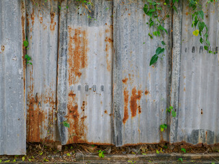 Galvanized fence wall is rusty.