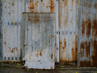 Galvanized fence wall is rusty.