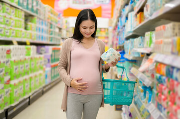 Pregnant woman shopping newborn products in the mall