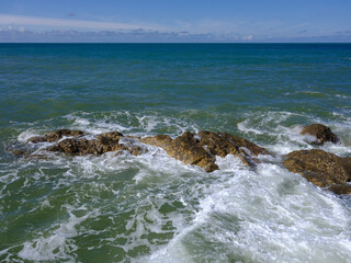 Rocky coastline with turbulent sea at Les Sables d'Olonne, commune in the Vendee department in the Pays de la Loire region in western France
