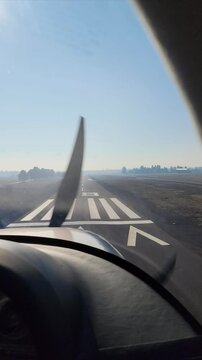 A small aircraft lands at Sunriver Airport near Bend, Oregon, in 4K 60fps. Cockpit view captures the runway, open landscape, and aircraft shadow during final approach, highlighting a smooth touchdown