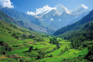 Obraz premium Majestic mountains rise above lush green valleys in a tranquil landscape