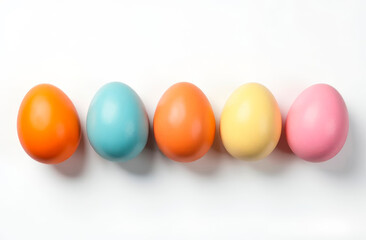 multicolored chicken eggs in a row on a white background with copy space and place for text. Easter banner or food theme