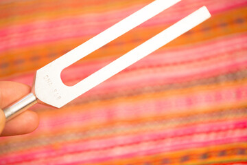 tuning fork on a fabric.