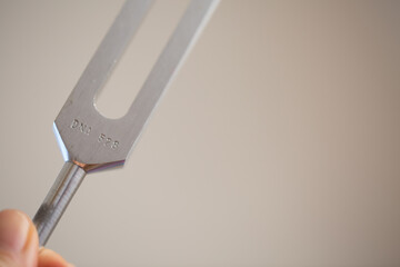 tuning fork on a fabric.
