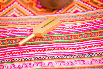 tuning fork on a fabric.