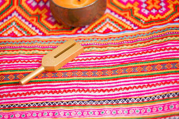 tuning fork on a fabric.