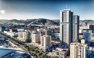 Aerial view of Santa Cruz de Tenerife on a sunny day. Skyscrapers and coastline from drone, Canary...