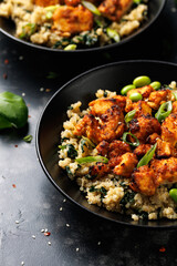 Sweet and sour tofu with spinach quinoa and steamed edamame beans. Healthy food.