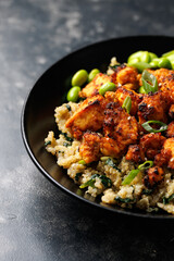 Sweet and sour tofu with spinach quinoa and steamed edamame beans. Healthy food.