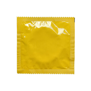 A vibrant yellow, sealed foil condom wrapper isolated on a clean white background, ideal for health, safe sex, and lifestyle-related stock photography.