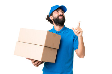 Delivery caucasian man over isolated chroma key background pointing up a great idea