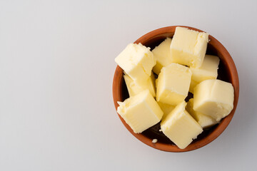 Butter that adds flavor to meals and is for breakfast on white background