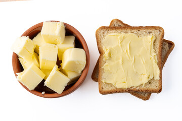 Butter that adds flavor to meals and is for breakfast on white background