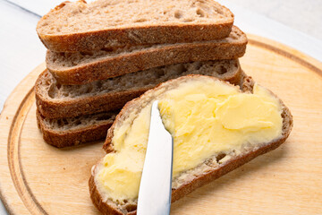 Butter that adds flavor to meals and is for breakfast on wooden background