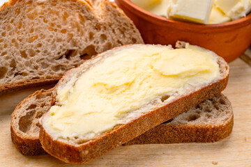 Butter that adds flavor to meals and is for breakfast on wooden background