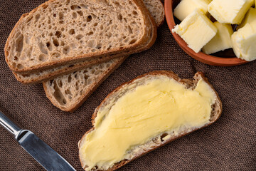 Butter that adds flavor to meals and is for breakfast on brown vintage background