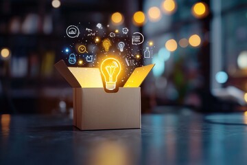Open cardboard box with glowing light bulb and creative icons representing innovative ideas and concepts in a modern workspace setting