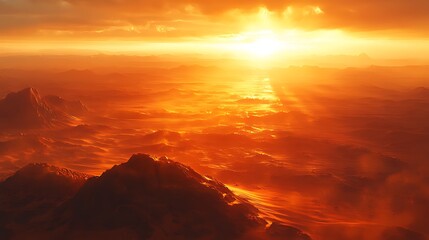 Fiery sunset over a hazy, mountainous landscape.