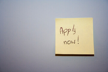 A motivational sticky note on a wall urging viewers to take action. Ideal for inspiring career-focused projects or personal development themes.