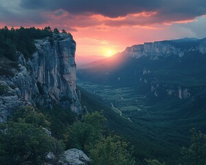 Majestic sunset over a deep valley, dramatic cliffs, and lush greenery.