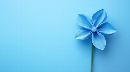Obraz premium Minimalist blue pinwheel on pastel background with soft lighting