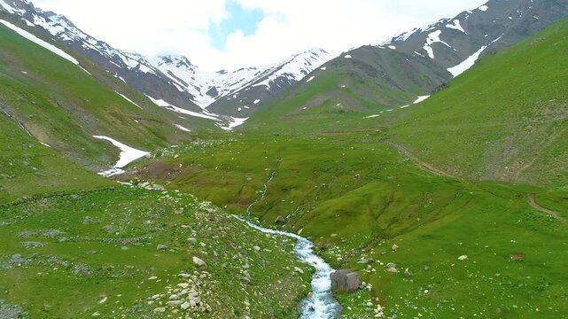 Aerial view of the valley, Parwan Province , Afghanistan, river and grass, in the spring, in daylight.