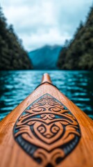 Beautiful Maori canoe gliding on calm ocean waters during golden hour with rich traditional decorations
