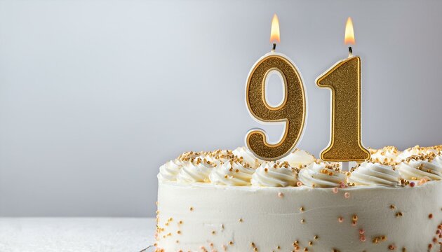Decorated white cake for birthday or anniversary party, candle number 91, white background