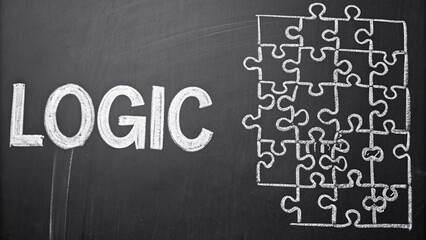 Obraz premium Intricate white chalk puzzle creating a logic challenge on a blackboard evoking a sense of curiosity and problem-solving in an educational background setting