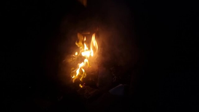 Waste burning with fire flames in the fireplace. Indian hindu festival holi or holika dahan represents waste management or the way to overcome bad things by burning bad waste.
