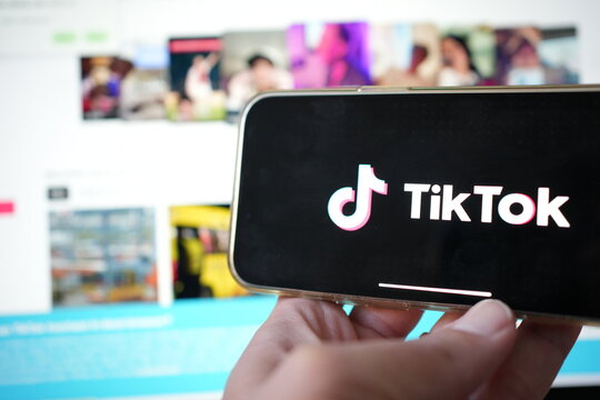 Roosendaal, The Netherlands - February 2, 2025: Person holding a mobile phone displaying the logo of  TikTok,  a personalized video content and entertainment platform from China.