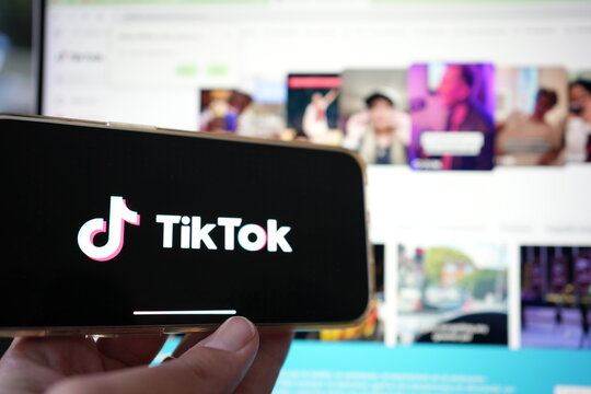 Roosendaal, The Netherlands - February 2, 2025: Person holding a mobile phone displaying the logo of  TikTok,  a personalized video content and entertainment platform from China.