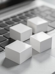 Obraz premium White cardboard boxes on a laptop keyboard. Online shopping and electronic commerce concept. 3D Rendering