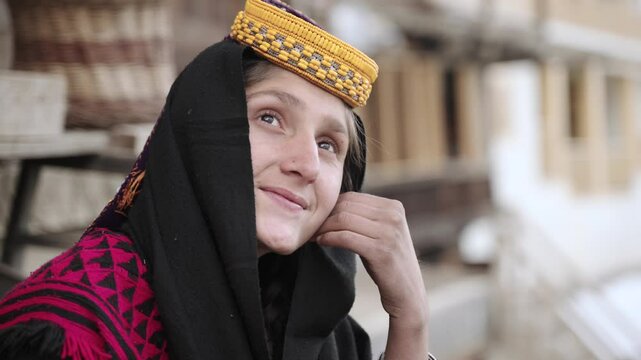 Portrait Young Kalashi Woman, Beautiful Traditionally Dressed girl in in Bumburet Valley at Winter, Chitral, Pakistan.