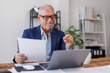 Business Documents, Mature Caucasian man checking searching document legal prepare paperwork or report for analysis TAX time,accountant Documents data contract partner deal in workplace 